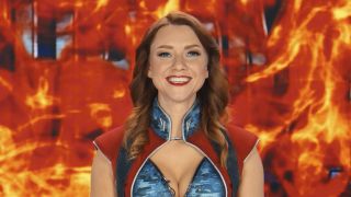 Firecracker in front of flames on TV screen in Gen V