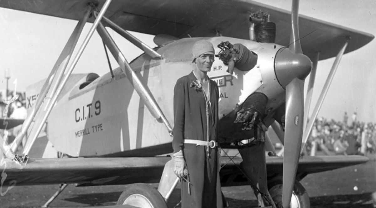 Amelia Earhart poses next to an airplane, not the one in which she disappeared, in 1928.