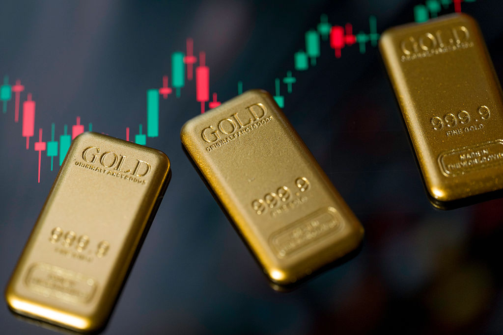Gold bars are displayed in a photo illustration, reflecting recent movements in gold prices