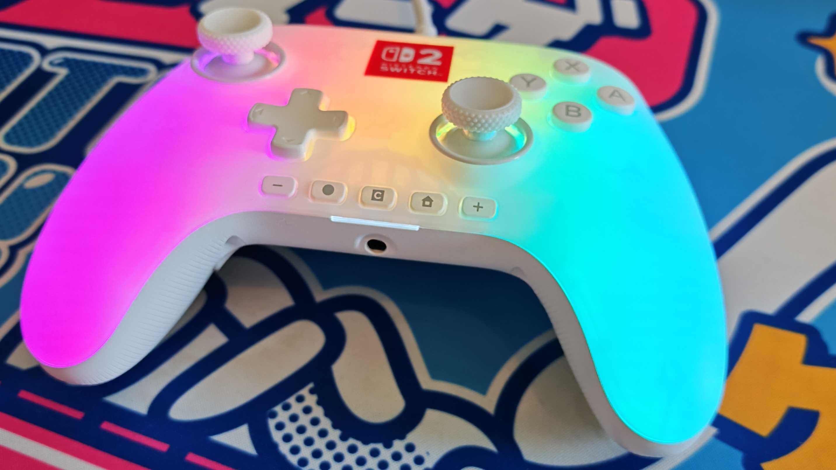 The PowerA Advantage Switch 2 Wired Controller on a bright blue mouse mat.