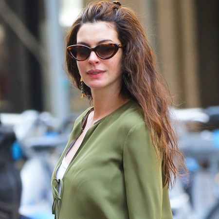 Anne Hathaway wore the hybrid mesh Mary Janes shoe trend with a green maternity outfit