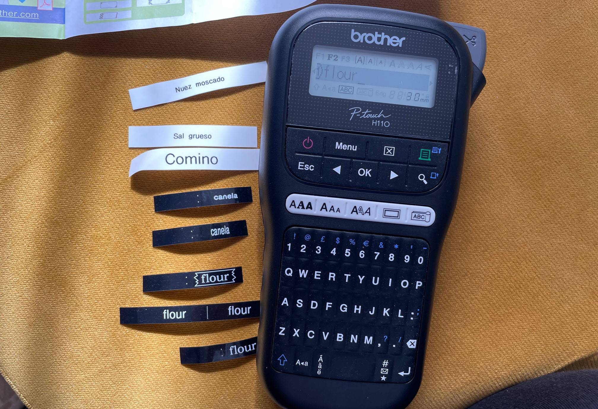 Brother PT-H110 label maker with sample labels