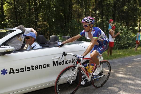 Robbie McEwen gets medical attention during stage 7.