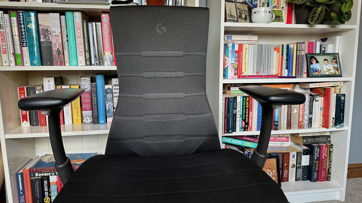 The arm rests pushed out wide while pulled up.
