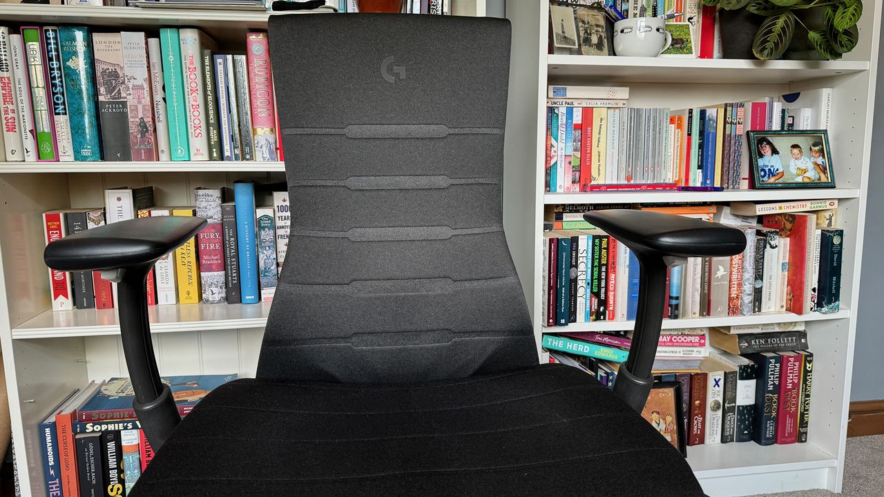 The arm rests pushed out wide while pulled up.