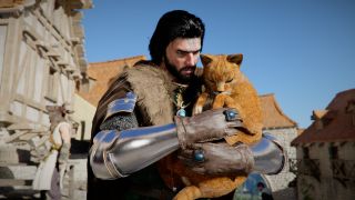 Kliff with an orange cat in his arms, petting it.