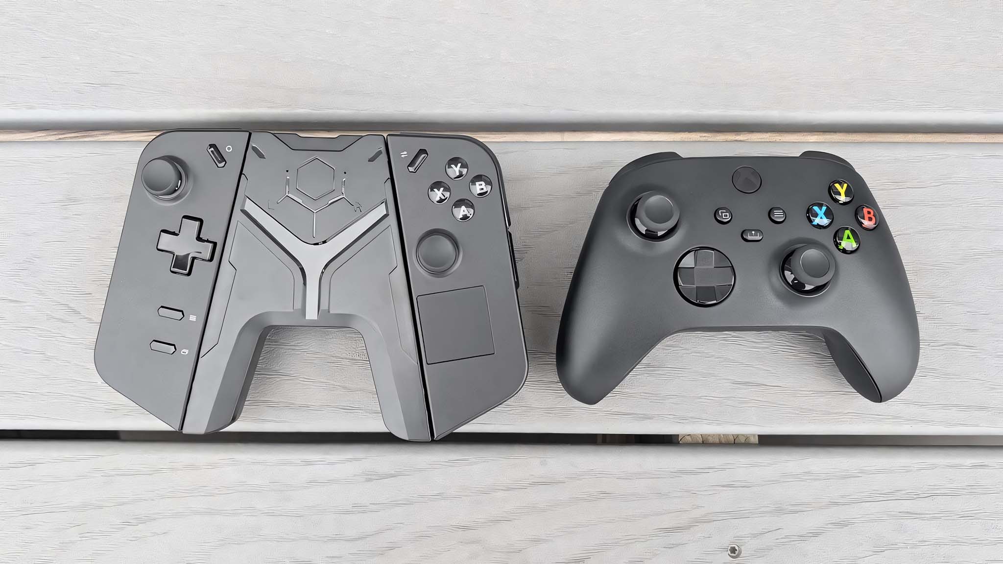 JSAUX Grip Connector for Legion Go Controller next to an Xbox controller.