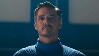 Pedro Pascal as Mr. Fantastic standing solemnly in The Fantastic Four: First Steps
