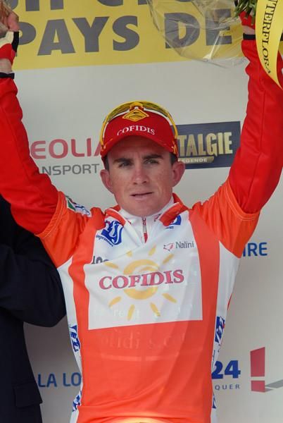 Samuel Dumoulin (Cofidis) celebrates his stage win on the podium.