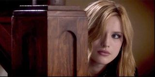 Amityville: The Awakening Bella Thorne looking around the staircase