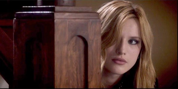 Amityville: The Awakening Bella Thorne looking around the staircase