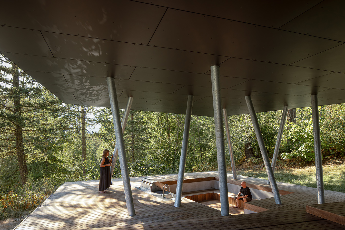 view of Passive House Forest Retreat, a timber structure engulfed in the tree canopy