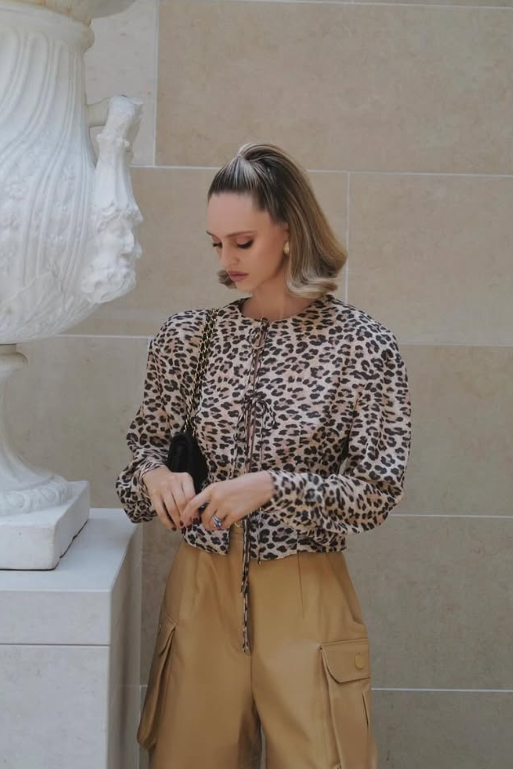 @saasha_burns wears leopard print jacket cargo trousers