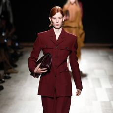 model wearing a burgundy suit