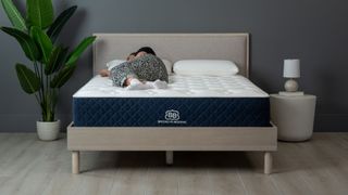 Brooklyn Bedding Signature Hybrid mattress with Cloud Pillow Top, photographed for Tom's Guide with sleep editor lying on it