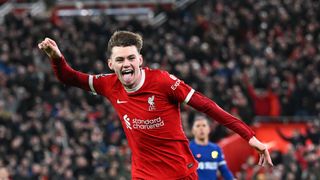 Conor Bradley of Liverpool celebrates ahead of the Chelsea vs Liverpool Carabao Cup final 2024