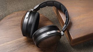 The Fiio FT1 headphones on wood.