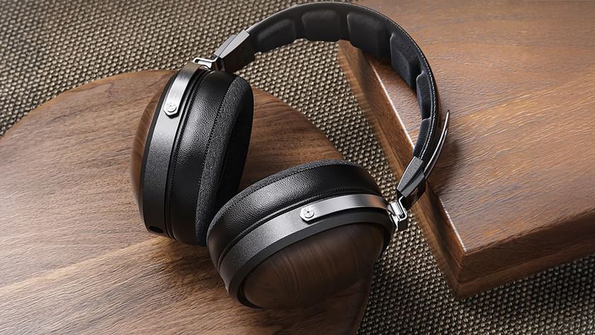 The Fiio FT1 headphones on wood.