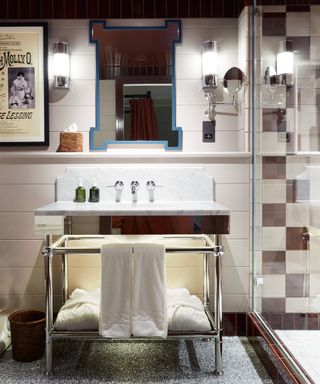 Hotel chic bathroom with colorful tiles and shower