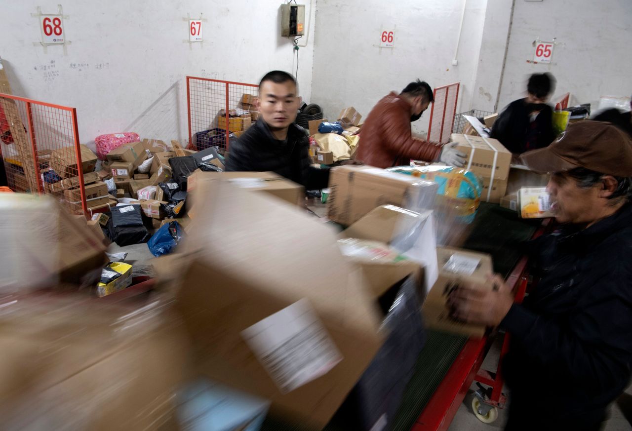 Workers sort shipments for Alibaba&amp;#039;s Singles Day event.