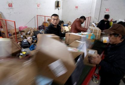 Workers sort shipments for Alibaba's Singles Day event.