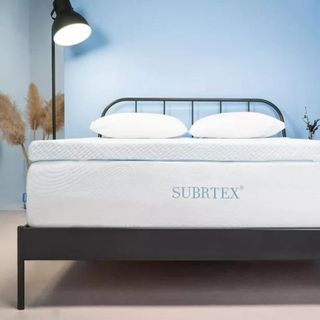 Mattress toppers on bed ontop of brand mattress