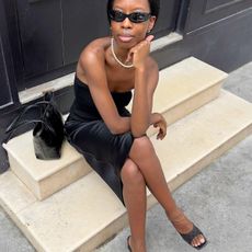 Women wearing elegant black top and skirt