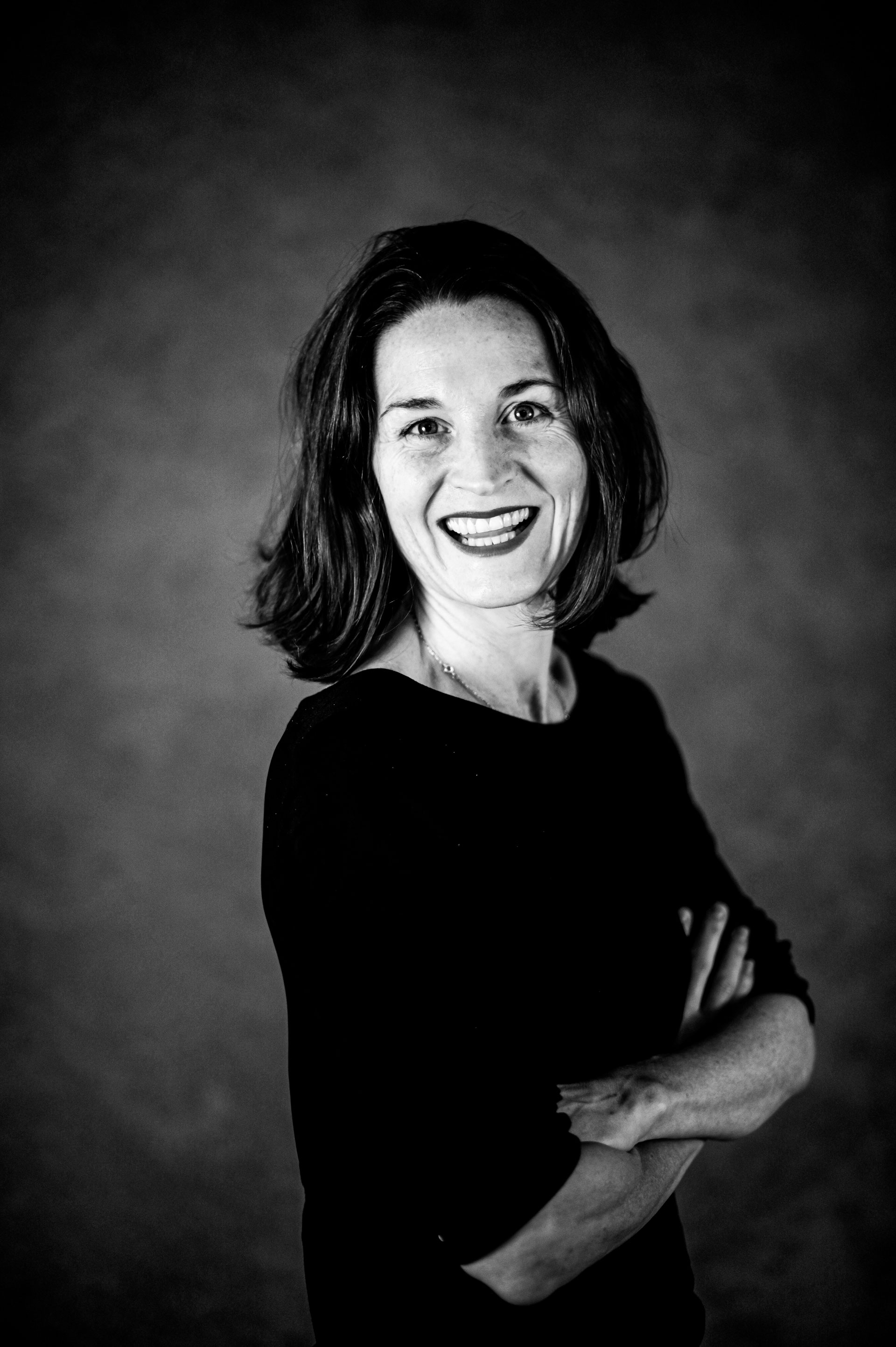 woman smiling in black and white image