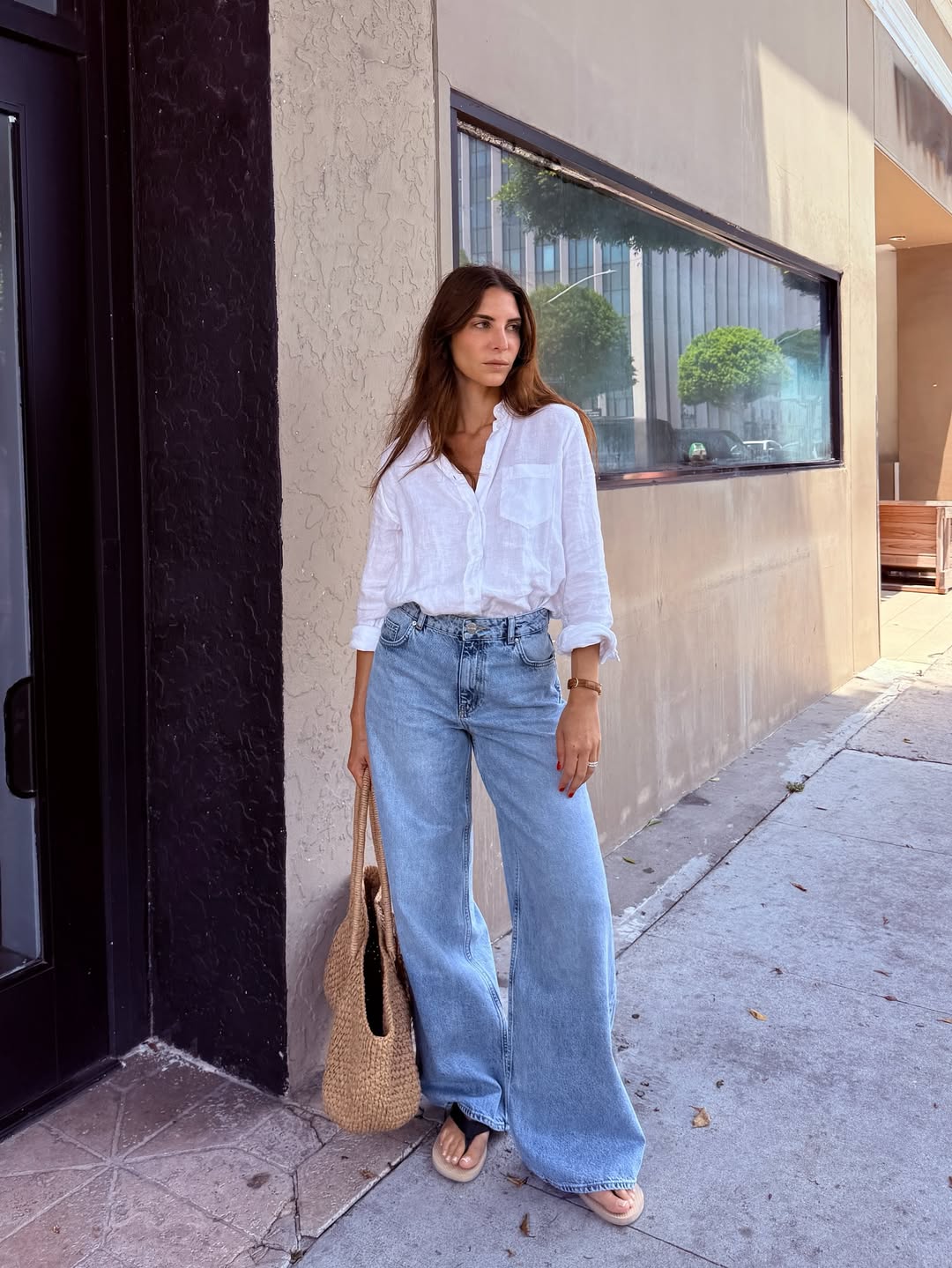 Jen in white linen top and blue jeans