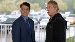 Daniel LaRusso (Ralph Macchio) and Johnny Lawrence (William Zabka) look around on Cobra Kai (2021)