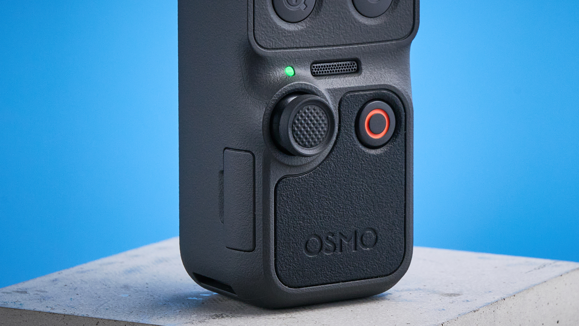 DJI Osmo Pocket 4 against a blue background