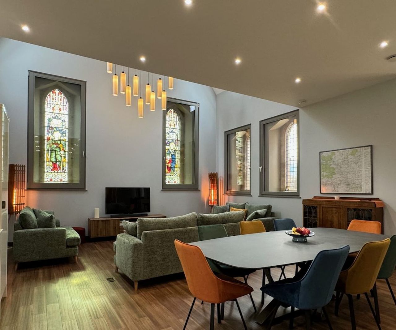 An open plan living room with stained glass windows