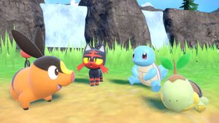 Pokémon Scarlet and Violet DLC screenshot showing several starter Pokémon