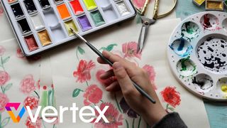Watercolour techniques - A photo of a woman painting flowers with watercolours. 