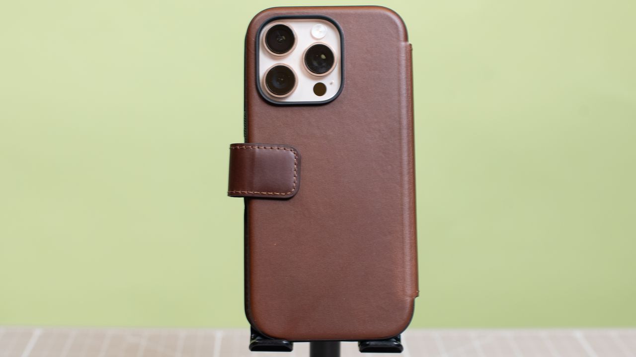 Nomad modern leather folio with iPhone 16 Pro in desert titanium inside showing multiple angles and buttons and camera cutout hole