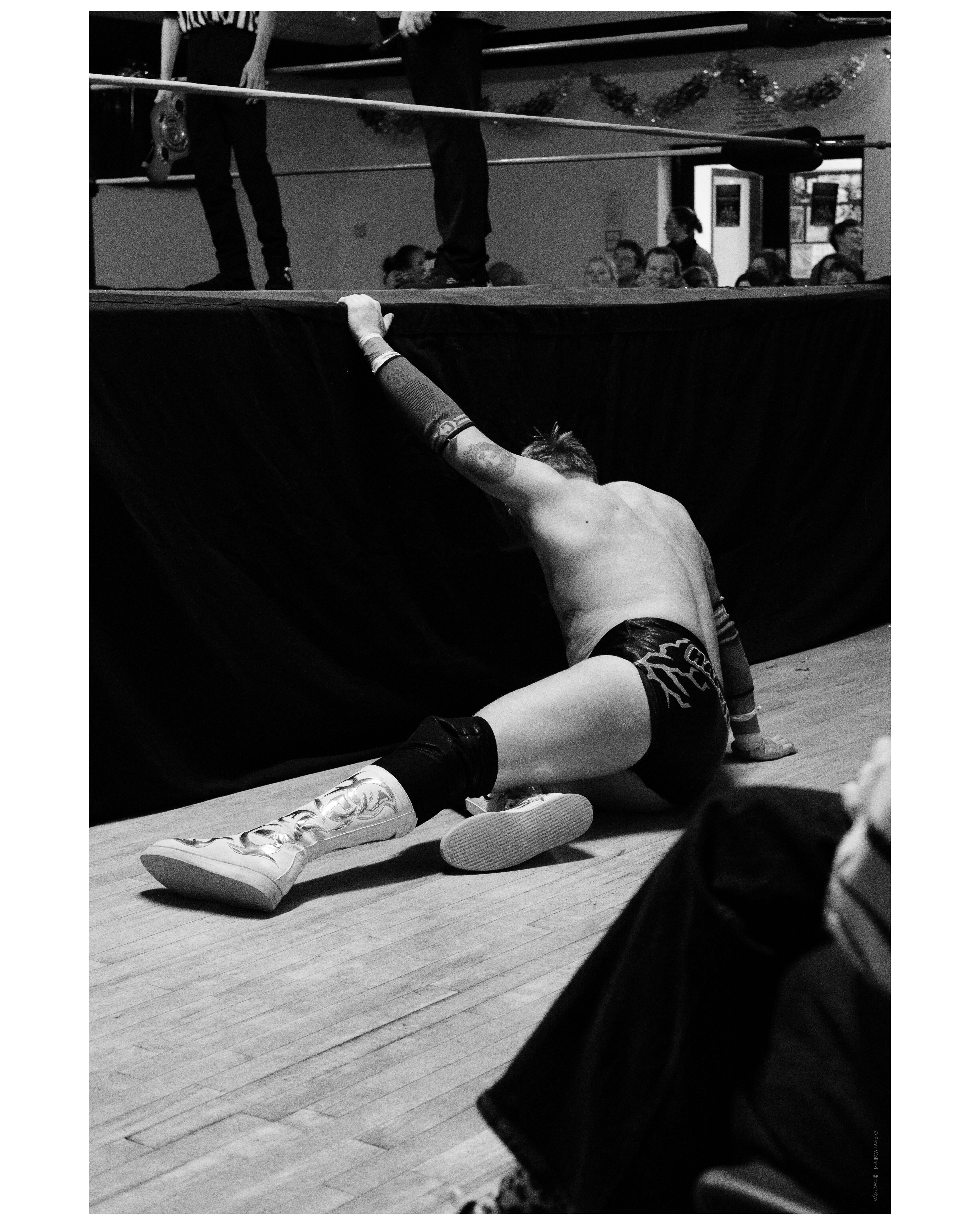 Black and white photo of a wrestling match