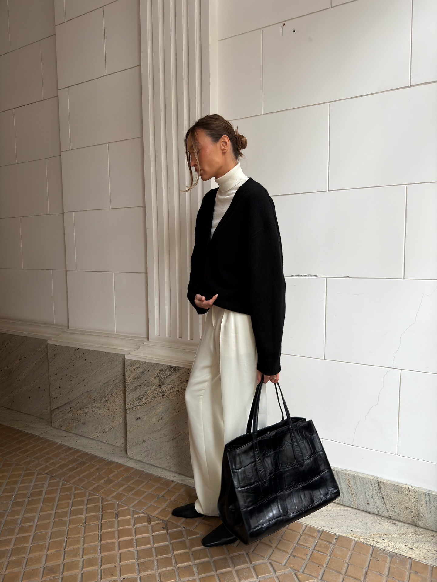 Influencer wearing deep v-neck sweater.