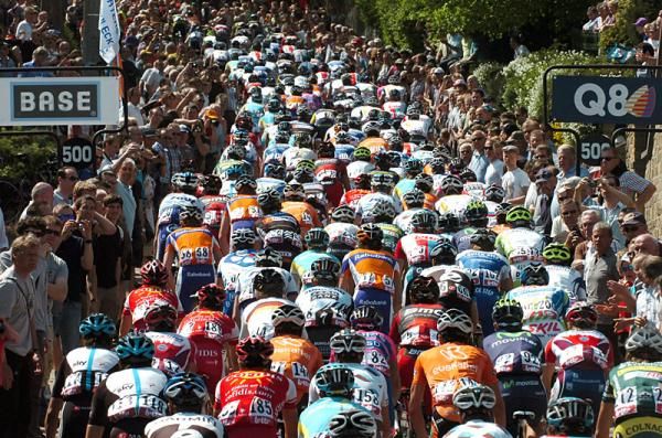 A tightly-packed peloton makes its way up the Mur de Huy.