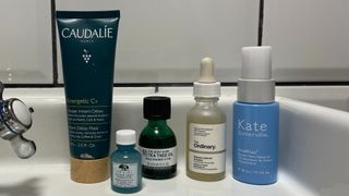 A lineup of W&H's Senior Beauty Editor's spot treatments, including a mask, three spot treatments and a serum