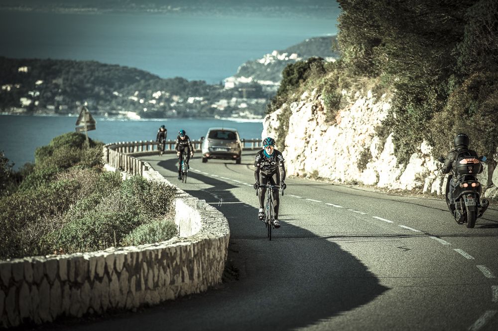 The riders climb above Cap Ferrat