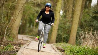 Woman cycling in the park