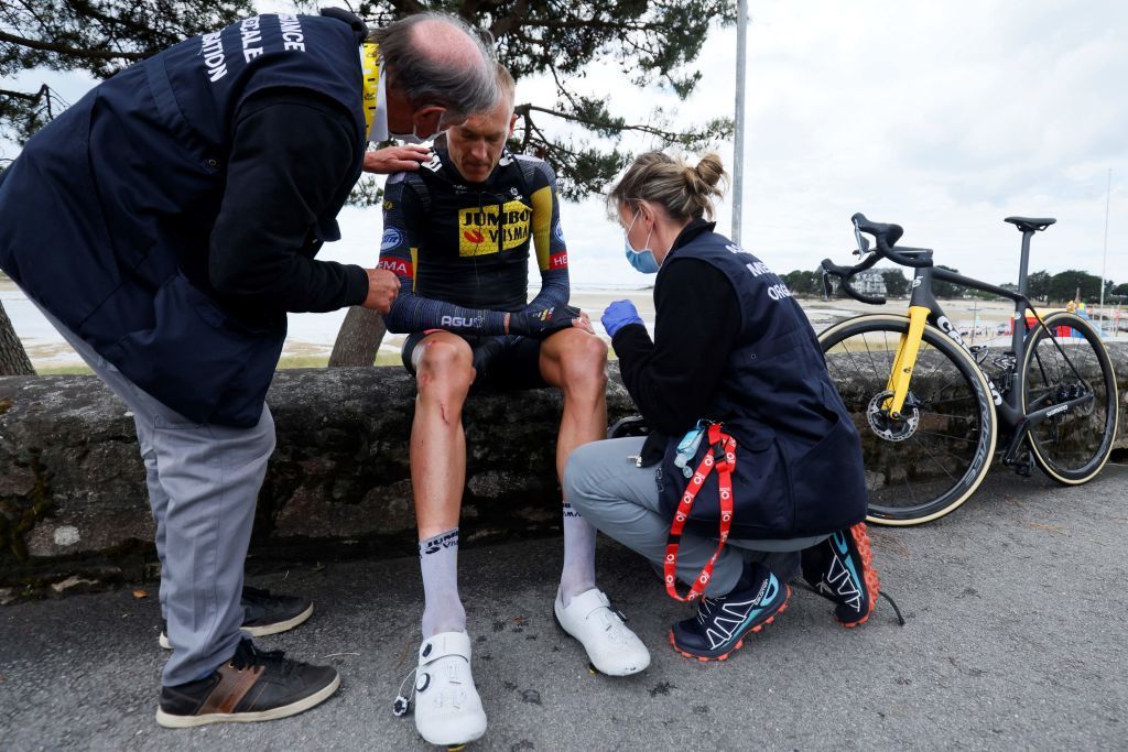 Team Jumbo Vismas Robert Gesink of Netherlands rests on a wall after crashing during the 3rd stage of the 108th edition of the Tour de France cycling race 182 km between Lorient and Pontivy on June 28 2021 Photo by Thomas SAMSON AFP Photo by THOMAS SAMSONAFP via Getty Images