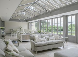 large open plan sunroom with windows and blinds