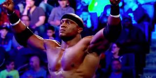 Bobby Lashley with his arms raised in a wrestling ring.