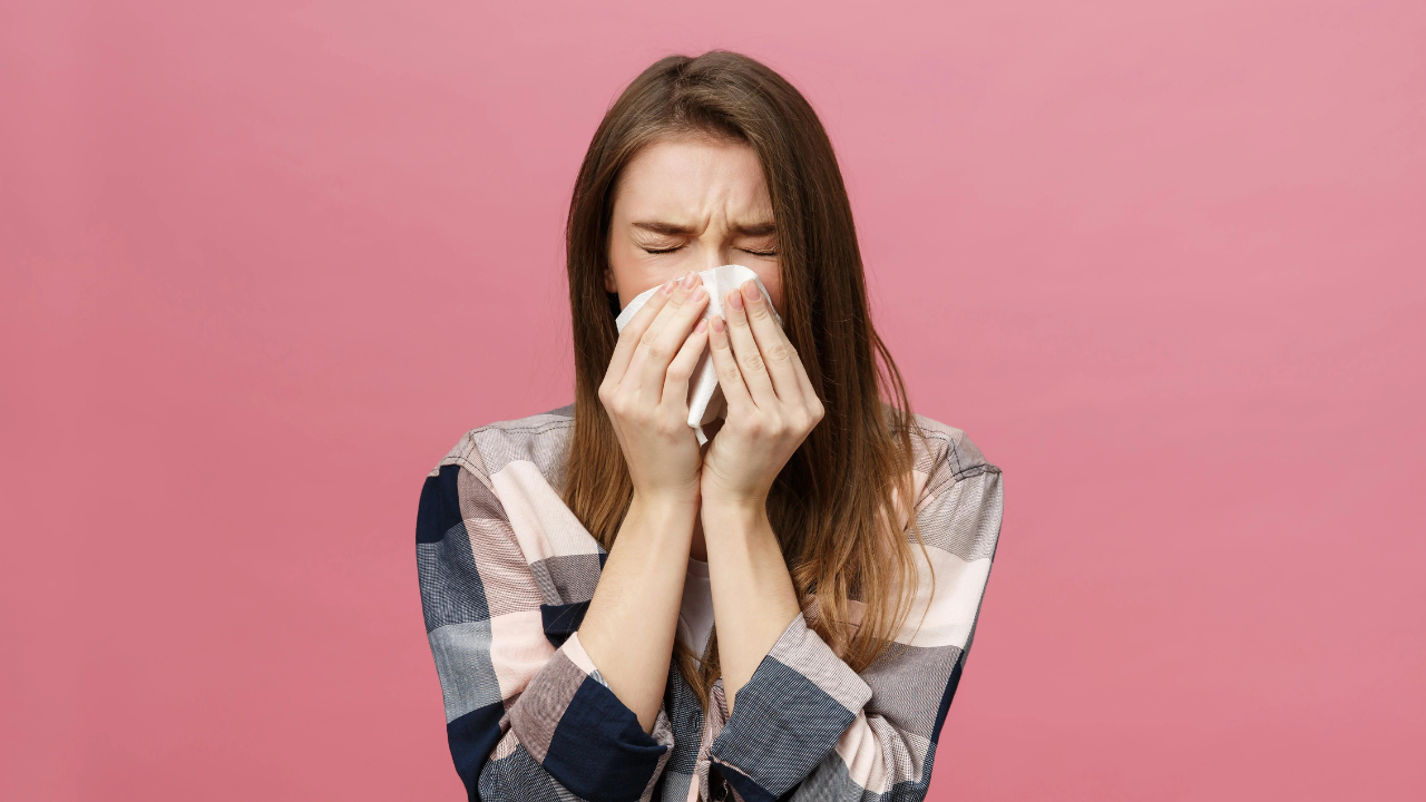 woman sneezing allergies