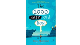blue book cover with a boy in red stood on front.