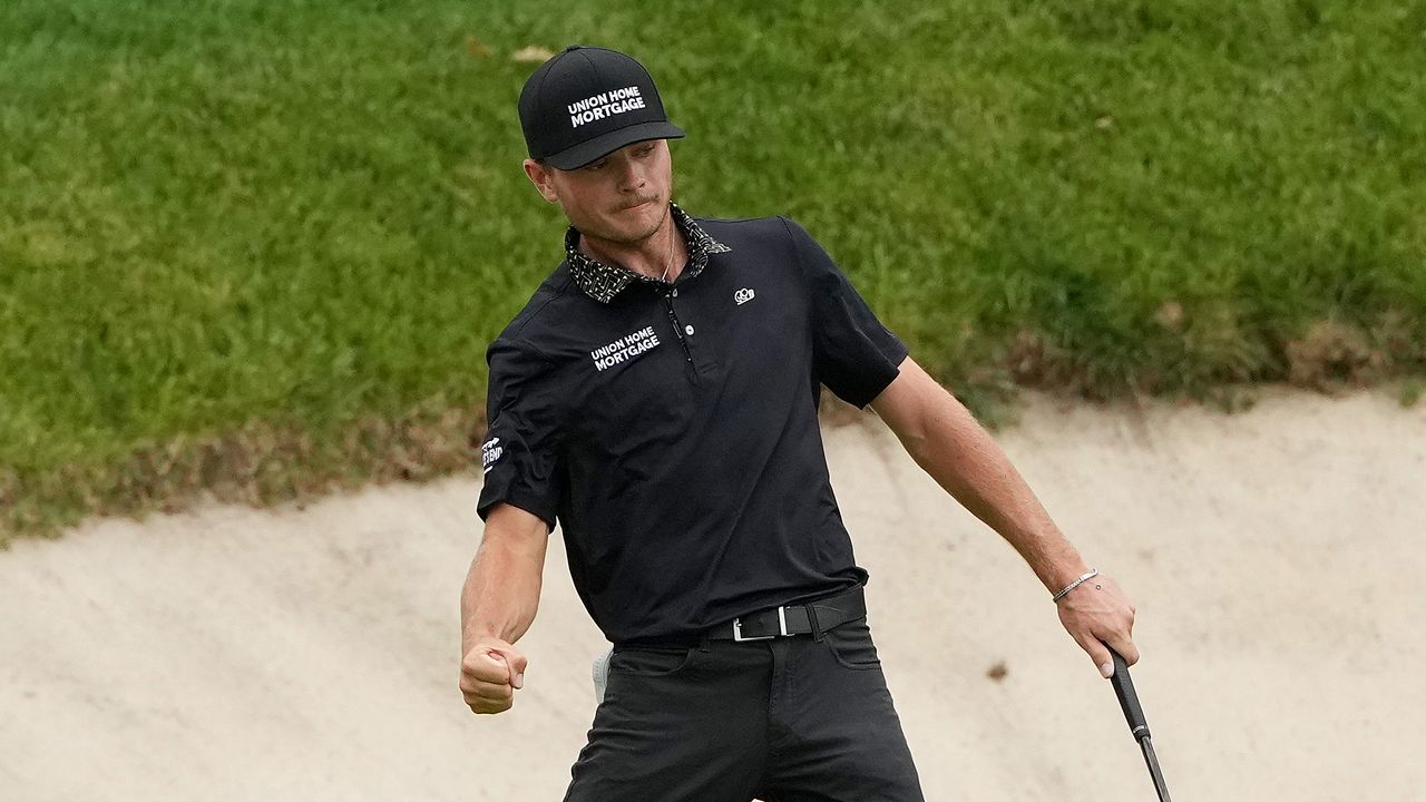 Luke Clanton celebrates holing a putt at the John Deere Classic