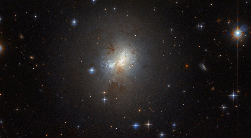 Astronomers Solve the Mystery of Small Galaxies with Monster Black Holes