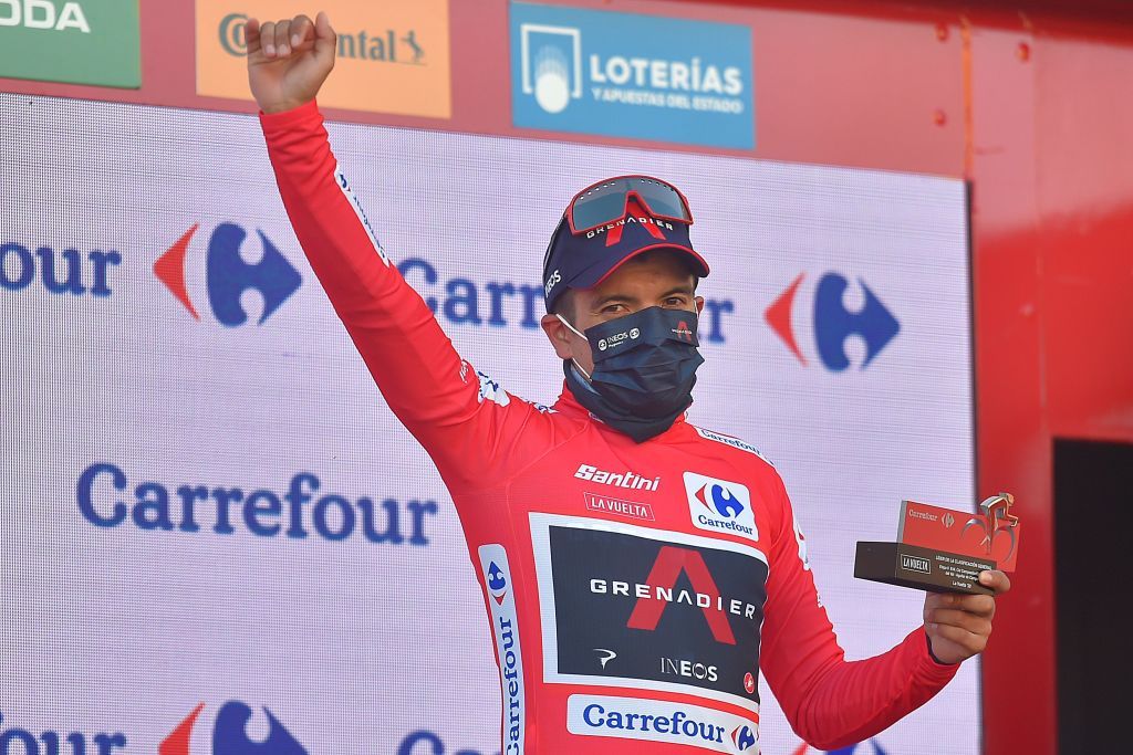 Team Ineos Ecuadorian rider Richard Carapaz celebrates on the podium as he keeps his overall race leader position after the 9th stage of the 2020 La Vuelta cycling tour of Spain a 1577km race from Castrillo del Val to Aguilar de Campoo on October 29 2020 Photo by ANDER GILLENEA AFP Photo by ANDER GILLENEAAFP via Getty Images