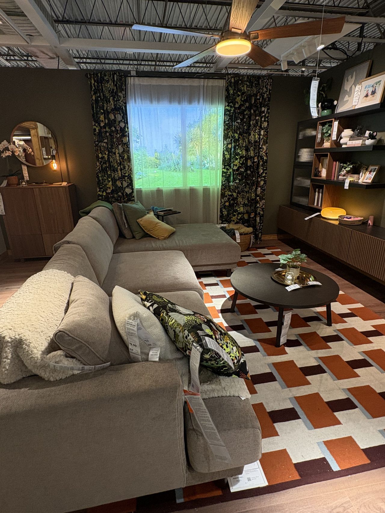 a large brown sectional sofa in an IKEA showroom.